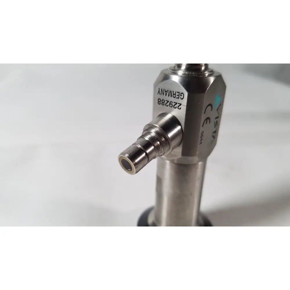 Silver metallic industrial valve with engraved markings and threaded connection for vista stereo 70° laparoscopic surgery with dents
