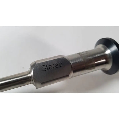 Silver metallic stereo audio jack with black rubber grip for reuse medical vista stereo laparoscopic surgery tool has dents