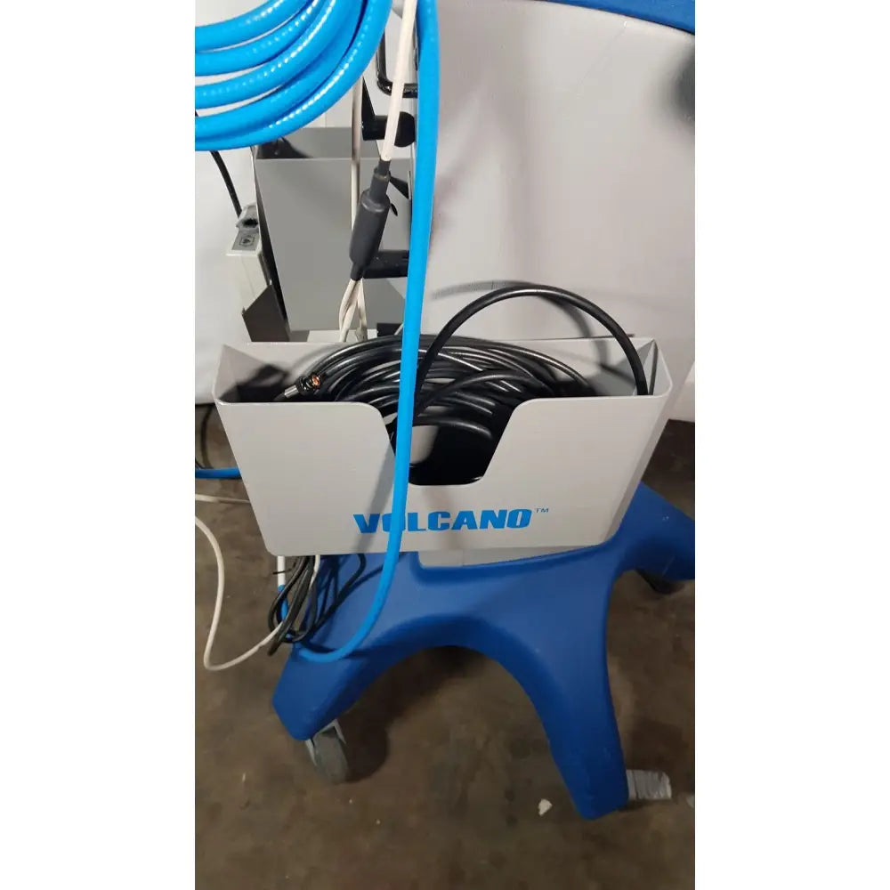 Blue and white volcano s5 imaging system medical cart with coiled hoses shown from the back for reuse medical operator’s manual