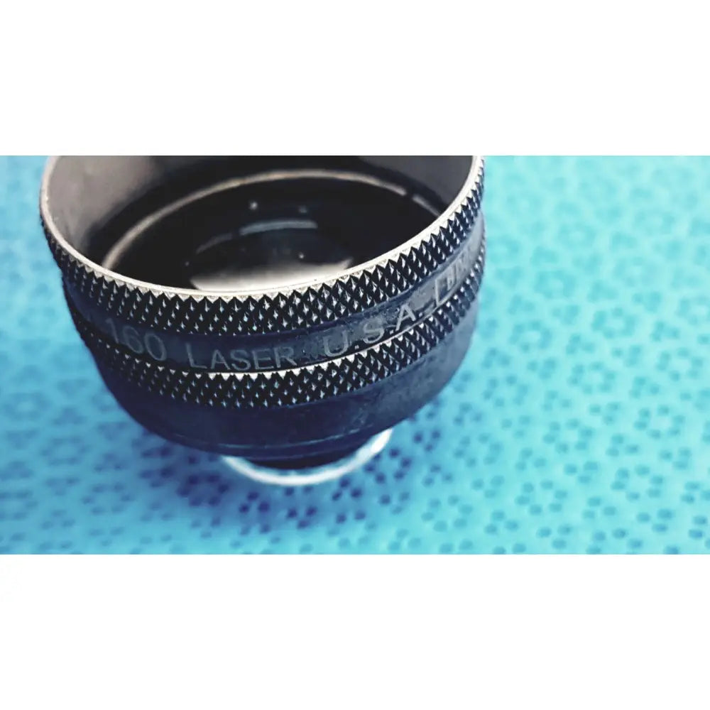 Black and silver volk super quad 160 ophthalmic laser lens with textured diamond-patterned grip ring for precision use