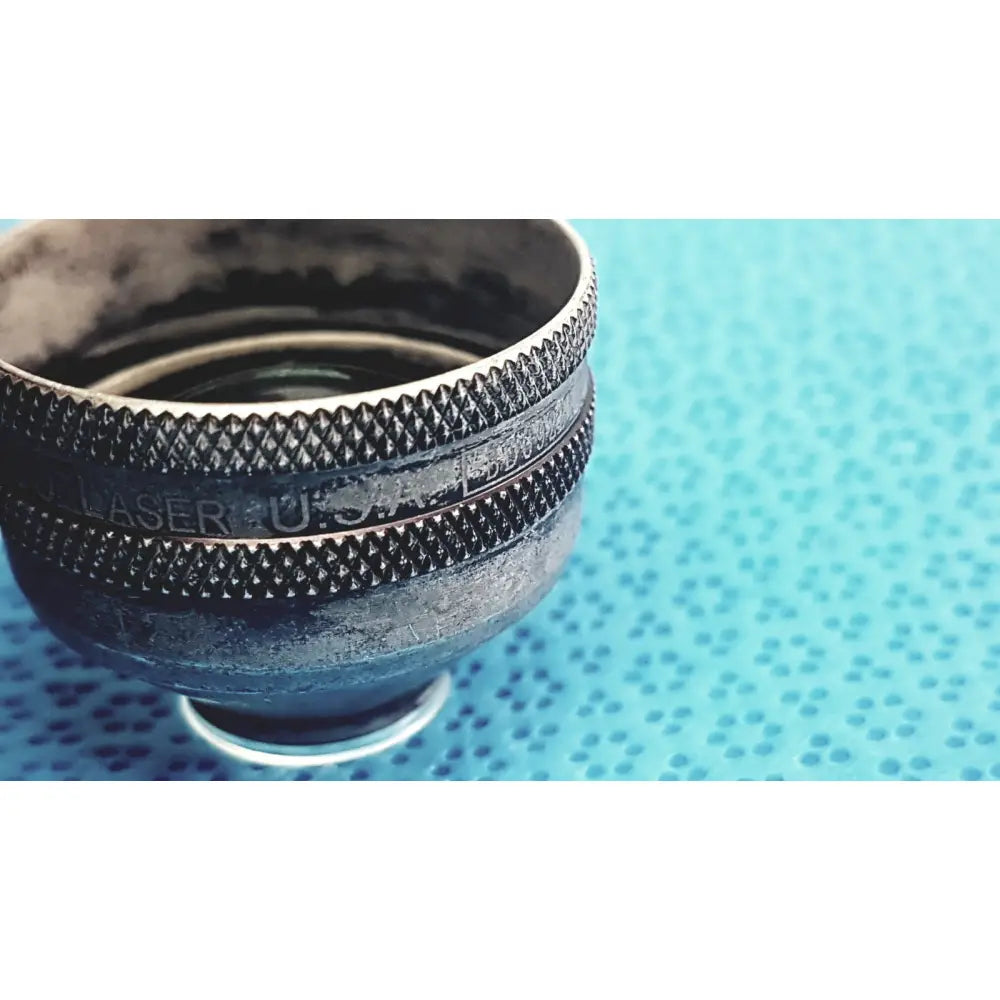 Black metal volk super quad 160 ophthalmic laser lens with textured grip ring and engraved laser u s a markings