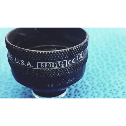 Black textured lens cap with engraved markings and qr code for volk super quad 160 ophthalmic laser lens back side