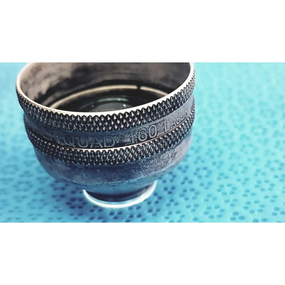 Black textured metal volk super quad 160 ophthalmic laser lens with engraved branding for precise laser treatments