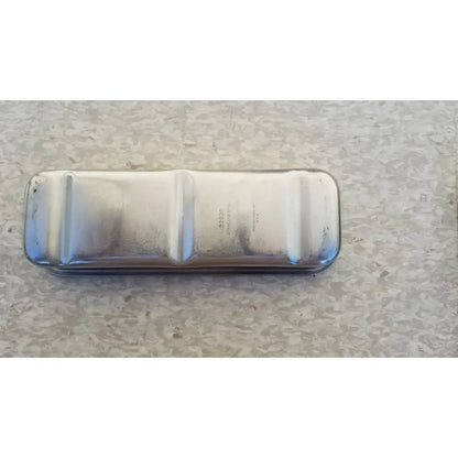 Silver metallic rectangular oil pan with three raised sections showing wear and rust for vollrath 82830 steel polished medical use