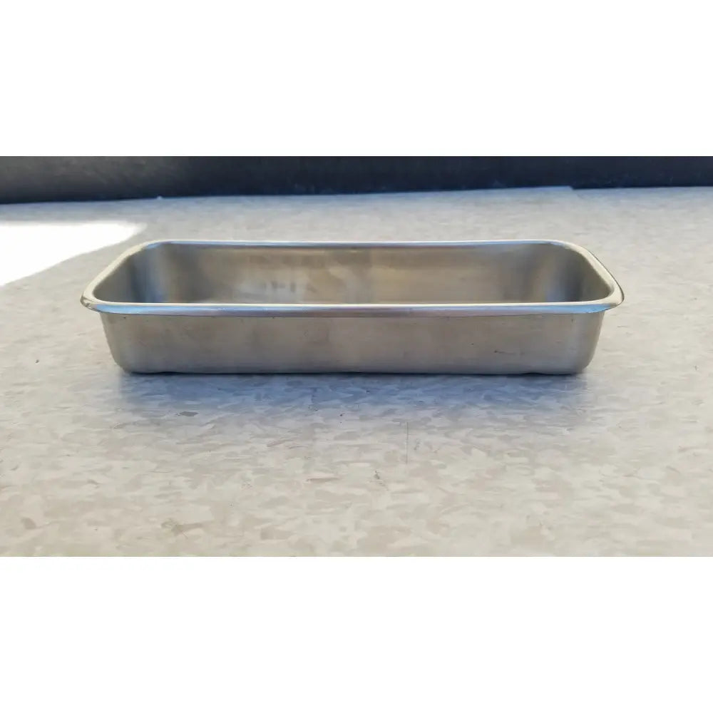 Vollrath 82830 rectangular stainless steel polished medical instrument tray with raised edges and smooth reflective surface