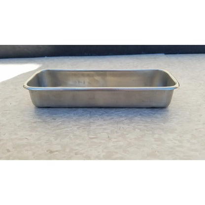 Vollrath 82830 rectangular stainless steel polished medical instrument tray with raised edges and smooth reflective surface