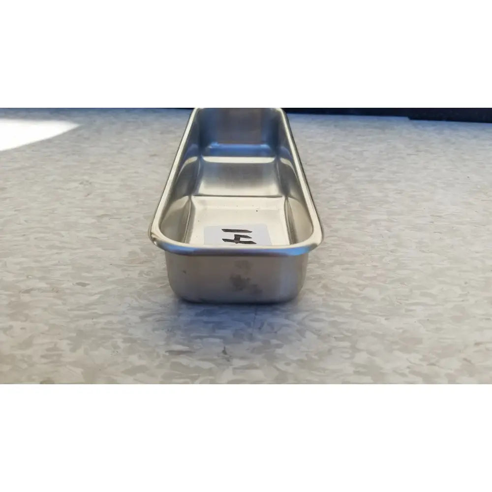 Vollrath 82830 rectangular stainless steel polished medical instrument tray with smooth reflective surface and raised edges