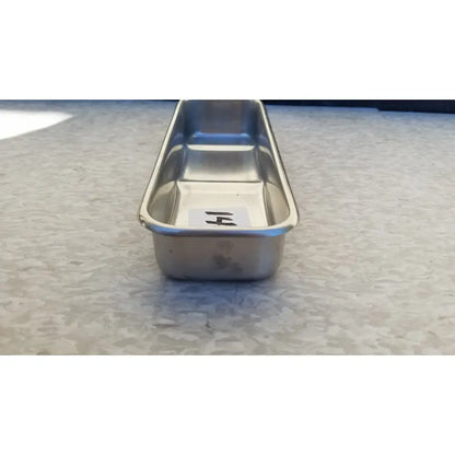Vollrath 82830 rectangular stainless steel polished medical instrument tray with smooth reflective surface and raised edges