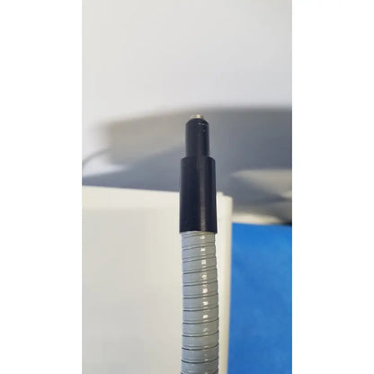 Gray corrugated hose with black plastic connector on volpi intralux 5000 fiber optic illuminator dual gooseneck microscope light