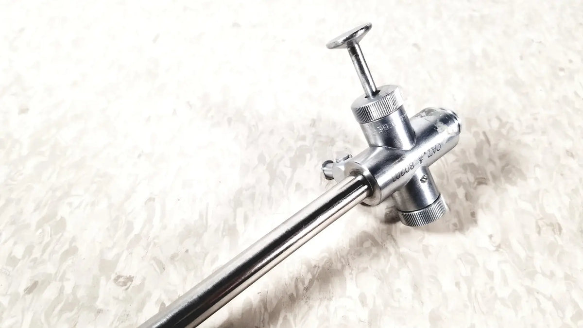 Silver-colored metal vwgh cat endoscope sheath with long slender shaft and threaded knobs for precise control reuse medical use