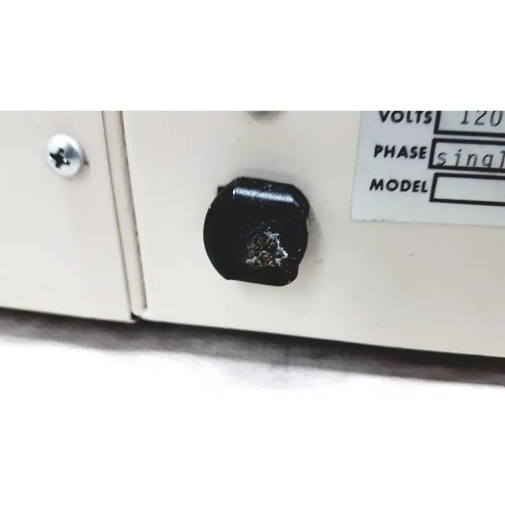 Black circular power switch with worn surface on vwr 1410 scientific vacuum oven for laboratory use