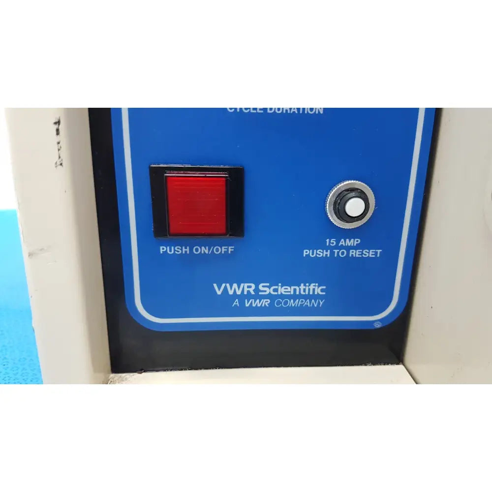 Blue control panel of vwr 1410 scientific vacuum oven with red on off switch and silver 15 amp reset button