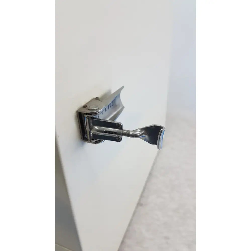 Silver metal door hinge with lever mechanism on vwr 1410 scientific vacuum oven for laboratory use