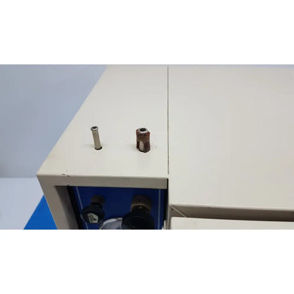 Beige scientific vacuum oven vwr 1410 with two cylindrical protrusions metallic and rusted on top surface