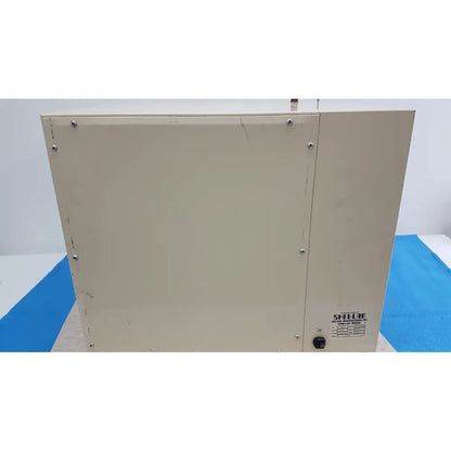 Beige metal scientific vacuum oven with silver screws and shellie label for laboratory electromotor use