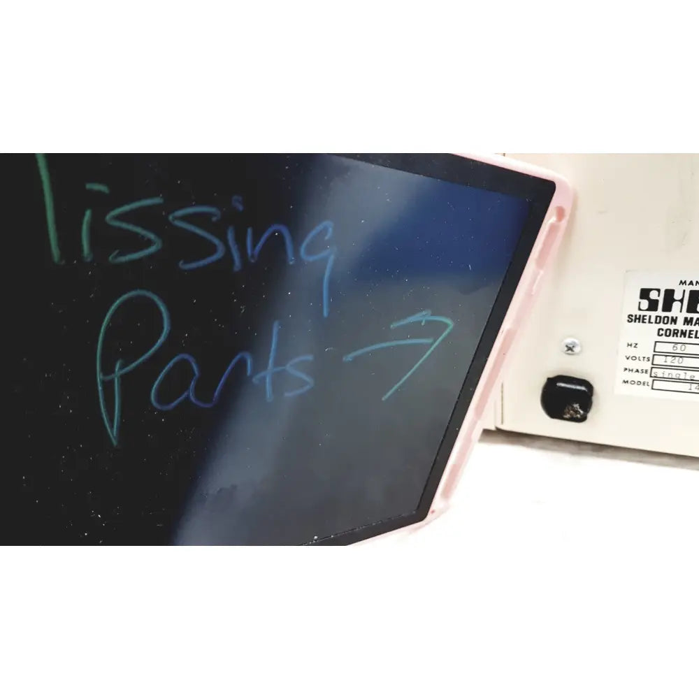 A pink-framed digital whiteboard with missing parts message on a vwr 1410 scientific vacuum oven laboratory unit