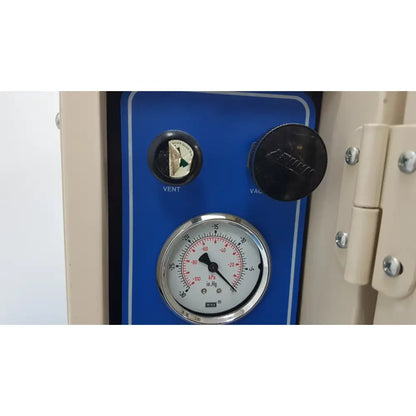 Blue control panel of vwr 1410 scientific vacuum oven with circular pressure gauge and black knobs for vent and vac functions