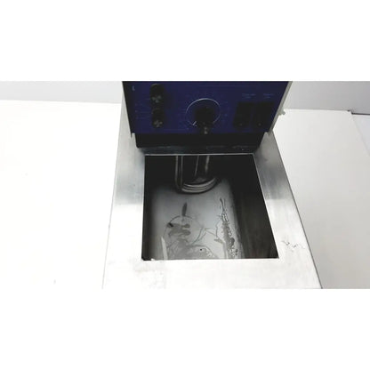 Blue control panel with black knobs on vwr scientific 1160 recirculating water bath above stainless steel tank