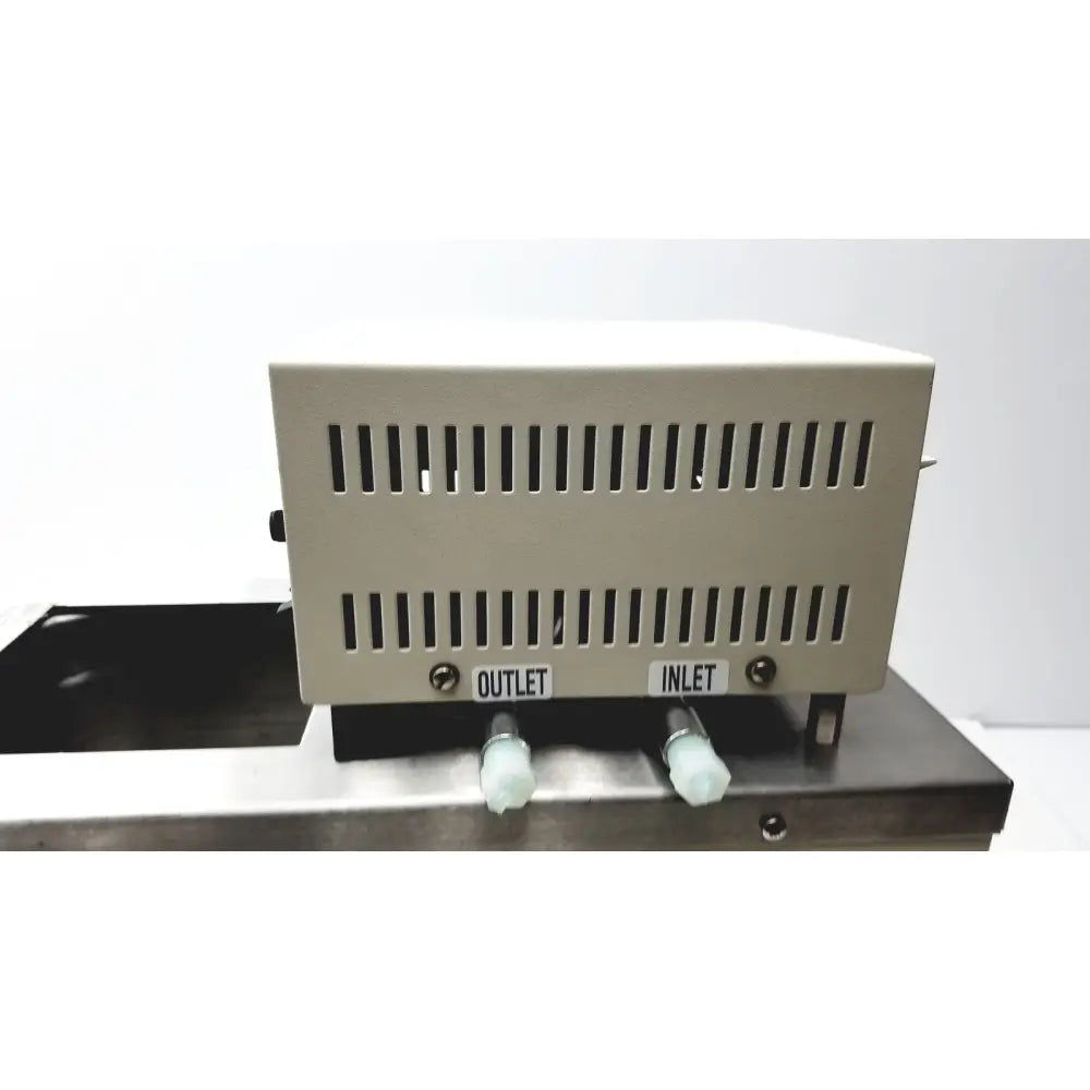 Beige rectangular vwr scientific 1160 recirculating water bath with vertical ventilation and labeled inlet and outlet ports