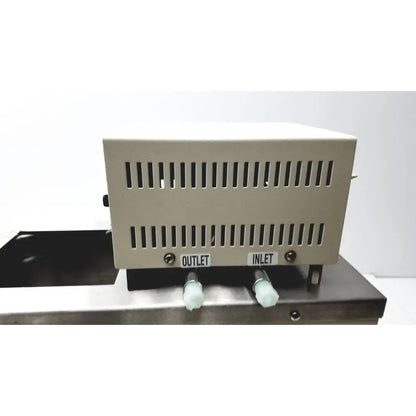 Beige rectangular vwr scientific 1160 recirculating water bath with vertical ventilation and labeled inlet and outlet ports
