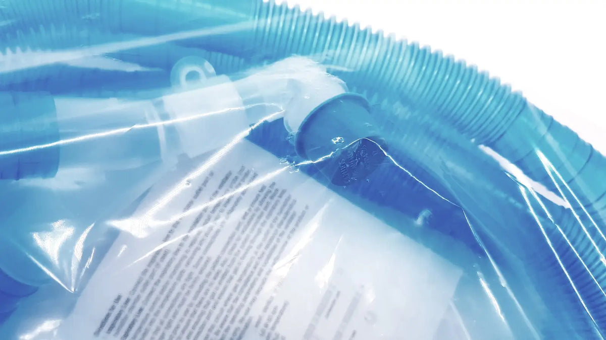 Blue plastic pool vacuum hose with white and dark blue attachment in clear packaging for vyaire 0y1778 airlife ventilator circuit