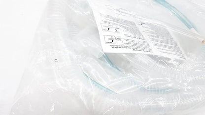 Light blue plastic nasal cannula in clear packaging with manual for vyaire airlife volume ventilator circuit