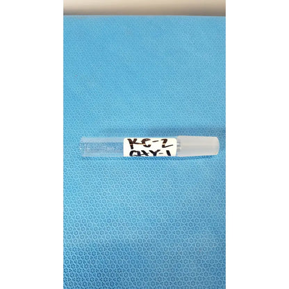 Clear plastic vial with white cap labeled kc-2 oxy part of vycor 24/40 ground joint corning laboratory glassware adapter
