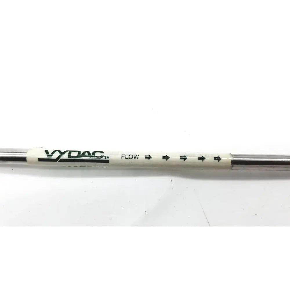 A white and metallic vydac peptide c18 column flow tube with black e970702-4-3 branding and directional arrows
