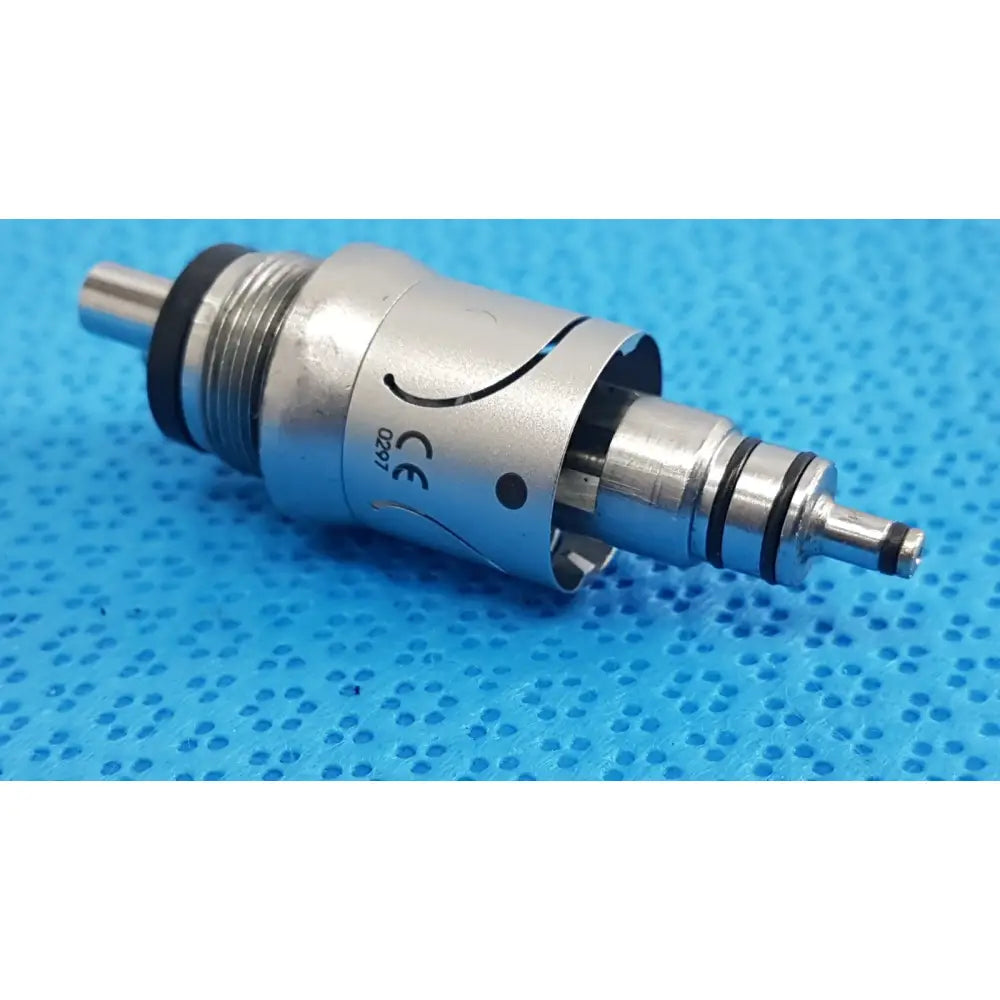 Silver w&h handpiece coupler with black rubber seals and engraved ce marking for dental connector use