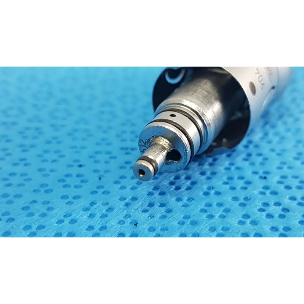 Silver metallic w&h handpiece coupler dental connector with threaded base and engraved markings for high-speed handpieces