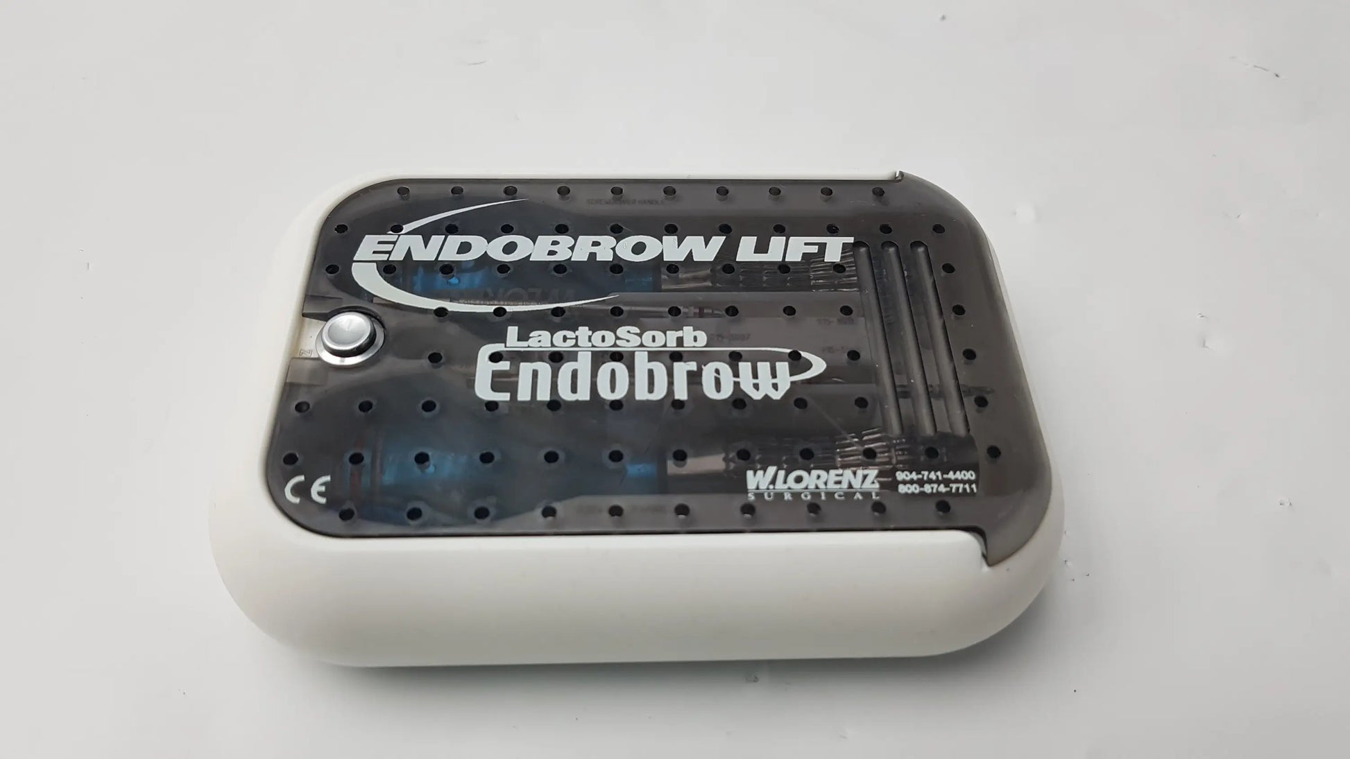 Black and white plastic endobrow lift device with perforated top surface for lorenz surgical endobrow lift kit fixation system