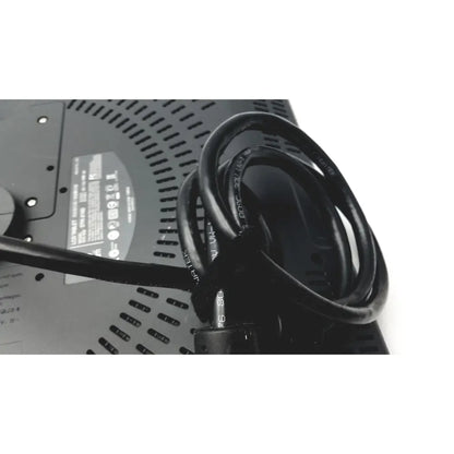 Black coiled power cord with printed specifications wrapped around the back of a wacom cintiq 21ux graphics monitor