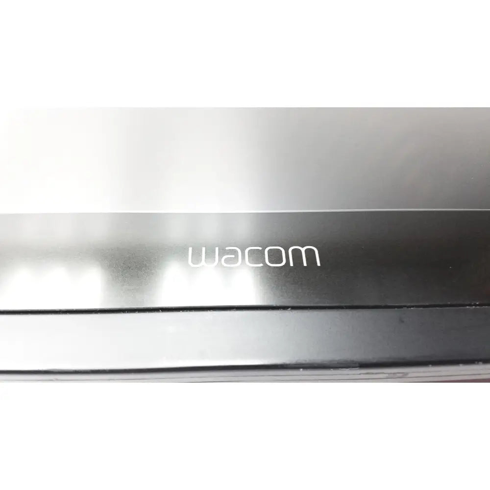 Black wacom cintinq 21ux graphics monitor with sleek matte finish and subtle white logo for professional digital art