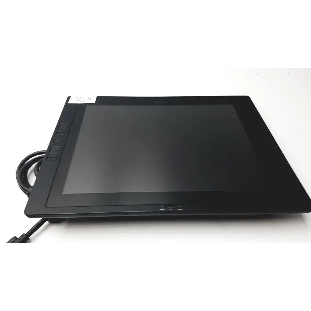 Black rectangular wacom cintiq 21ux graphics monitor with glossy screen matte bezel and physical buttons on left side