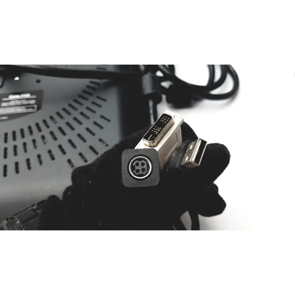 Black-gloved hand holding white silver dvi to usb adapter with 4-pin connector for wacom cintiq 21ux graphics monitor