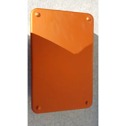 Orange rectangular plaque with rounded corners and four fasteners on wagner steriset storage container