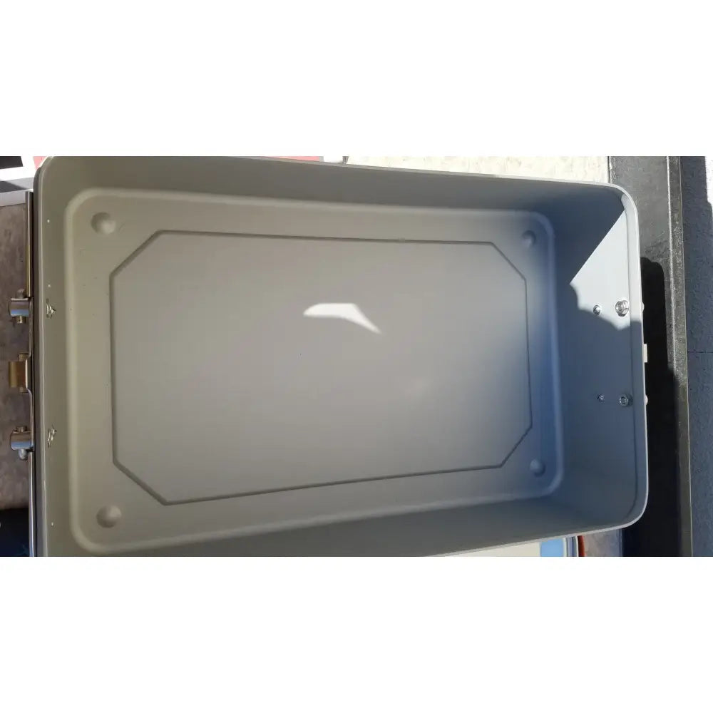 Gray rectangular metal wagner steriset storage container with rounded corners and textured interior for sterilization