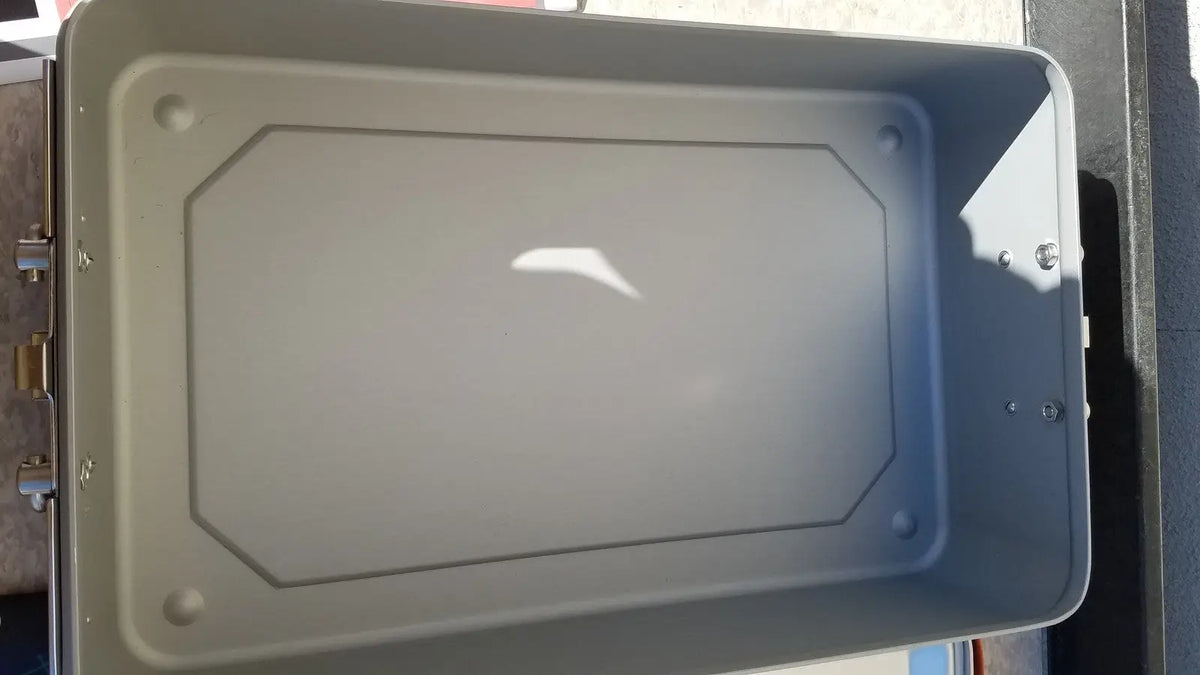 Gray rectangular metal wagner steriset storage container with rounded corners and textured interior for sterilization