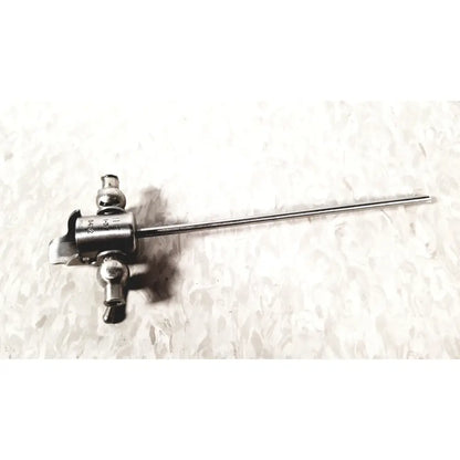 Medical endoscope with metallic shaft and control head featuring knobs and ports for laparoscopic instruments and obturator res reuse