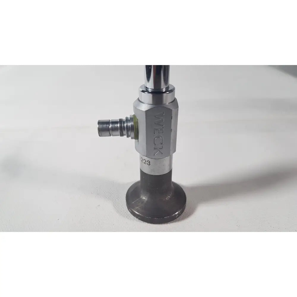 Silver and black industrial gas valve with tweck branding for reuse medical applications on weck 110410 degree scope