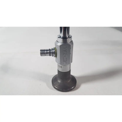Silver and black industrial gas valve with tweck branding for reuse medical applications on weck 110410 degree scope