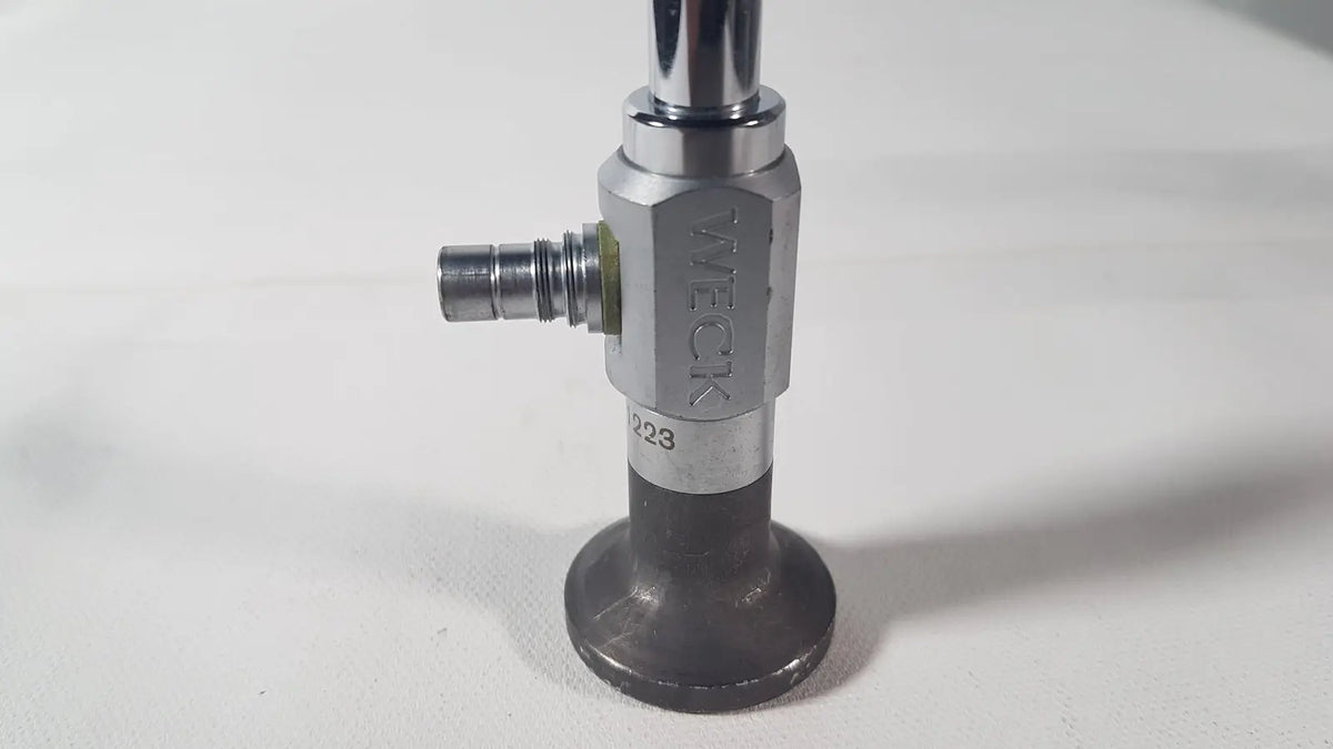 Silver and black industrial gas valve with tweck branding for reuse medical applications on weck 110410 degree scope