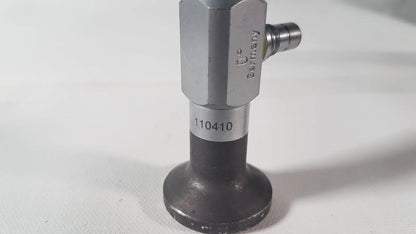 Silver-colored hexagonal valve with black base and stamped markings on the back side of weck 110410 0 degree scope for reuse medical use