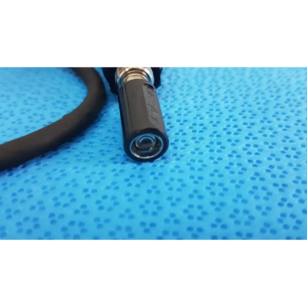 Black rubber-coated welch allyn bulb cable cord with metallic threaded end and embossed branding for illuminator bulb cable use