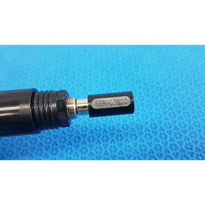 Black cylindrical welch allyn illuminator bulb cable cord with metallic threaded connection and ref 07800 engraved cap