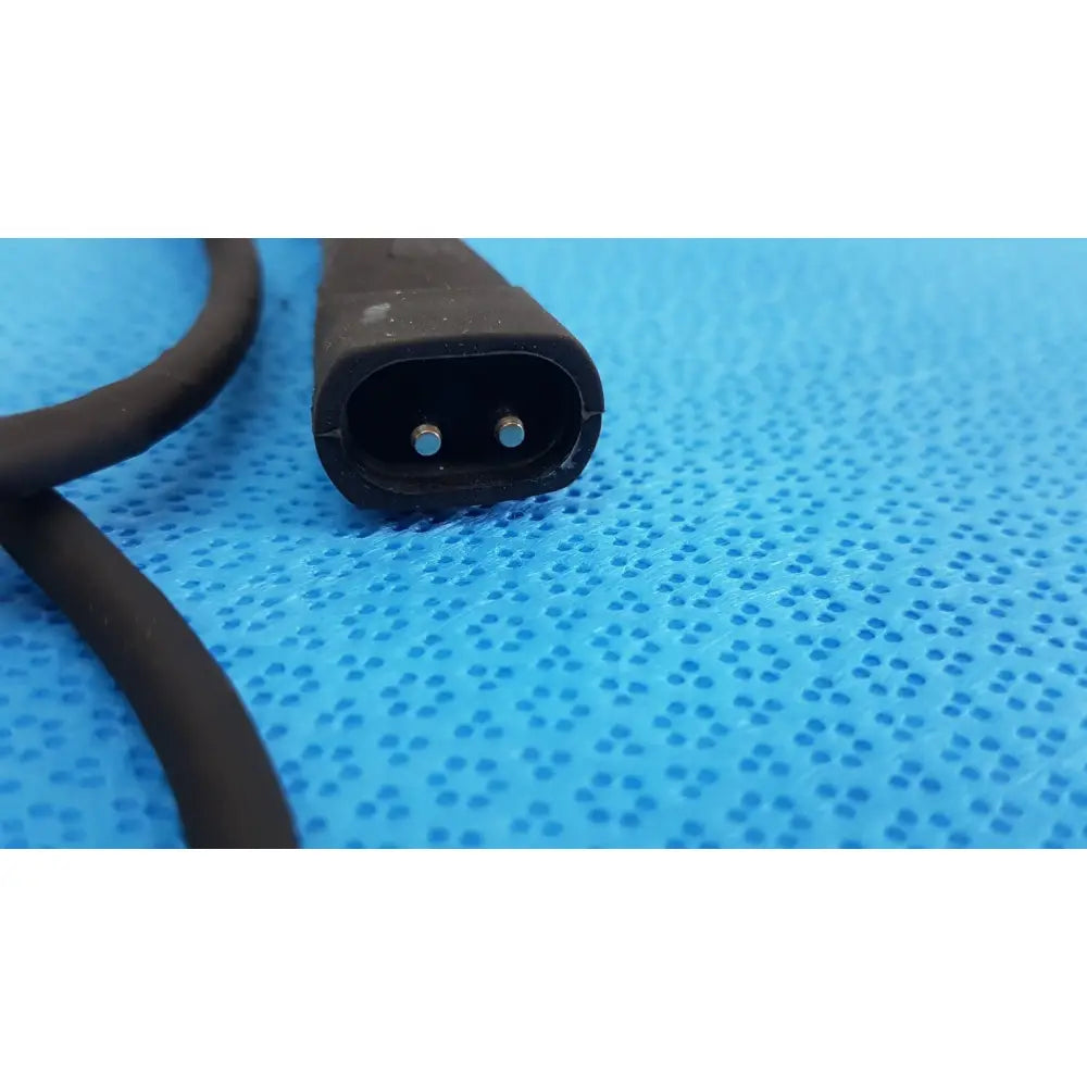 Black plastic welch allyn illuminator bulb cable plug with two metal contacts for medical lighting accessory