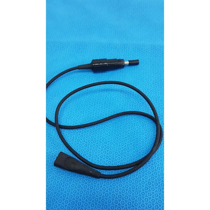 Black coiled welch allyn illuminator bulb cable with textured grip and metallic tip connectors for medical lighting use