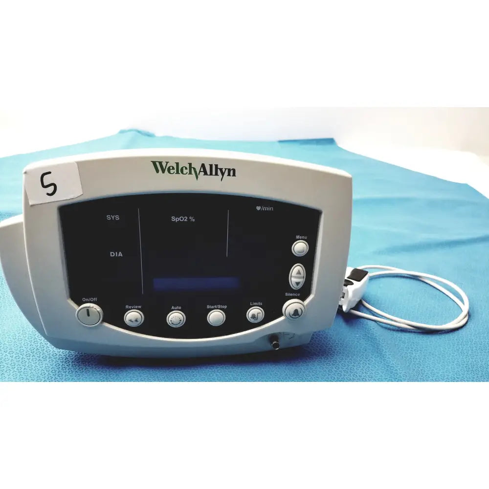 Welch allyn 300 series vital signs monitor with sleek gray pulse oximeter casing and black display showing readings