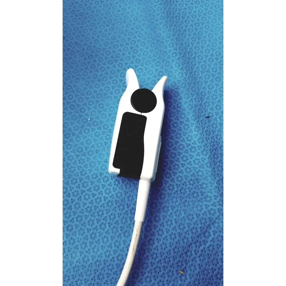 White plastic pulse oximeter clip with black sensor pad and cable for welch allyn 300 series vital signs monitor