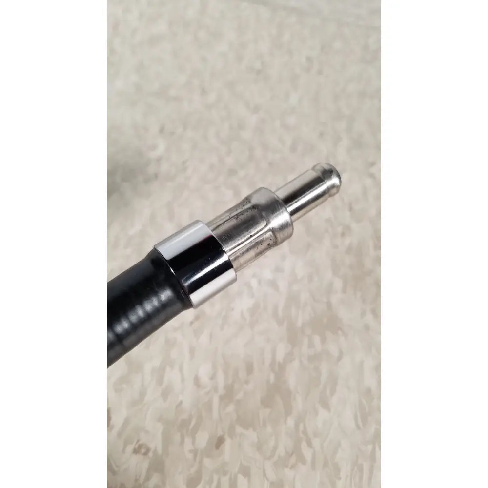 Black rubber hose with shiny metallic connector for welch allyn 48200 fiberoptic light pipe used in medical exams